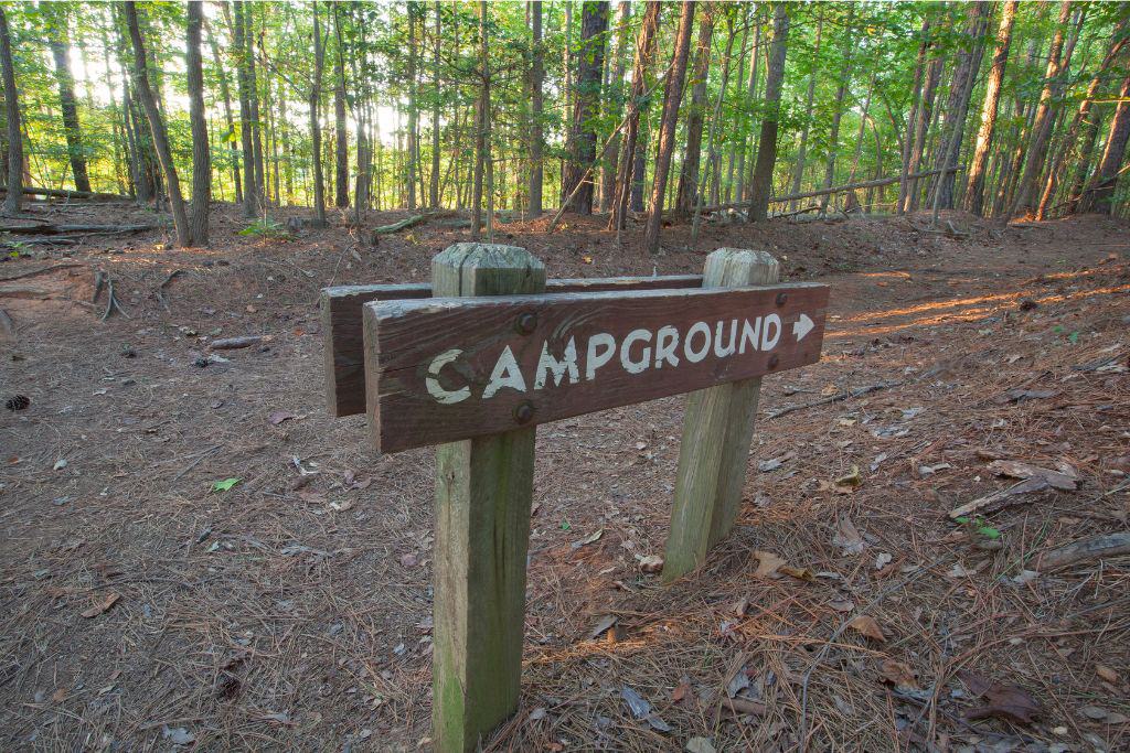 Campground sign in the woods. 
