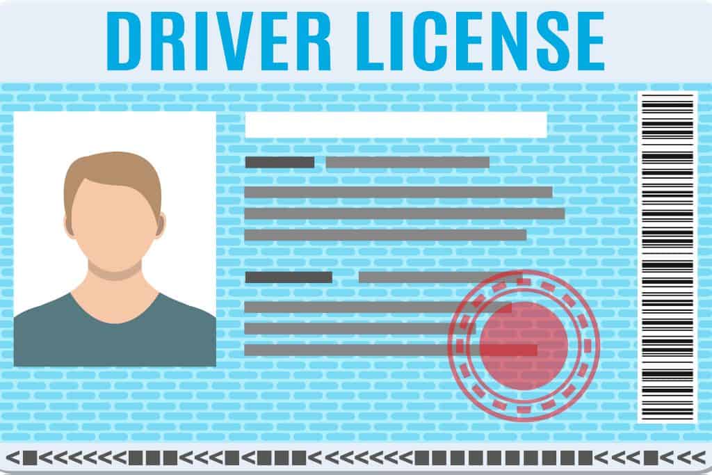 This is an illustration of a driver's license. It features a placeholder profile image on the left, textual information in the center represented by lines and blocks, and a barcode on the right side. The license is primarily blue with a brick-patterned background, a red circular stamp in the middle, and "DRIVER LICENSE" prominently displayed at the top in bold blue text.